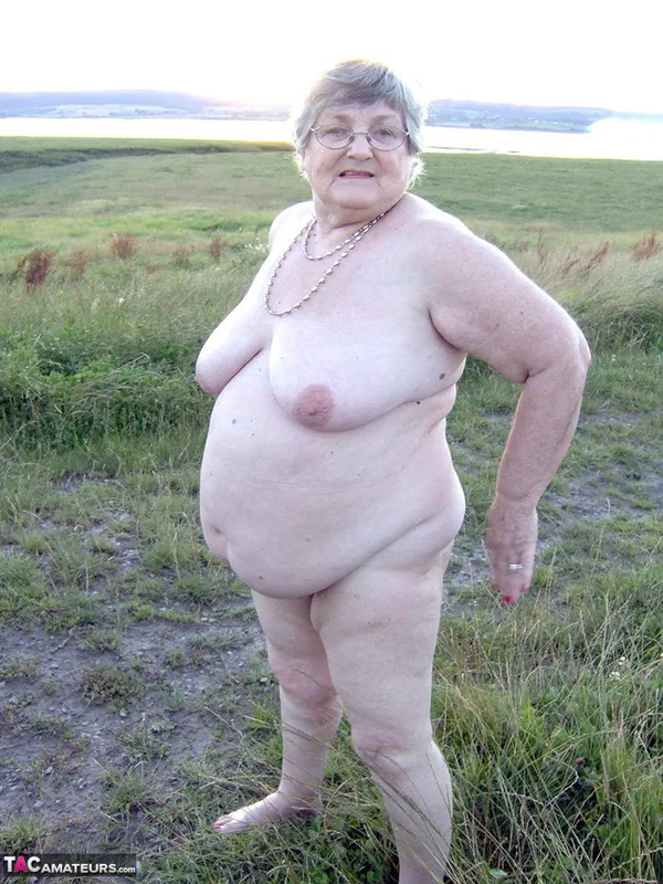 Fat nan Grandma Libby steps into a puddle before covering herself in mud  - Granny, BBW, Saggy Tits, Outdoor, Amateur, Chubby, Wet, Glasses, Curvy, Thick  - Photo 1