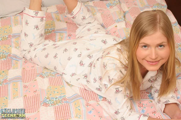 Young looking blonde Malina removes her pyjamas while masturbating on a bed  - Amateur, Teen, Cute, Pussy, Dildo, Spreading, Masturbation, Undressing, Close Up, Ass  - Photo 1