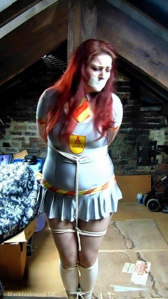 Redheaded plumper Mada Rose is tied to an attic post while clothed and gagged  - BDSM, Bondage, Uniform, Socks, Non Nude, Clothed, Skirt, Redhead, High Heels  - Photo 1
