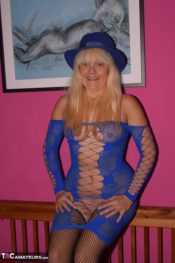 Old blonde sets her firm boobs free of a revealing dress in mesh stockings  - Mature, Lingerie, Amateur, Stockings, Big Tits, Spreading, Ass, Blonde, Feet, PAWG  - Photo 2