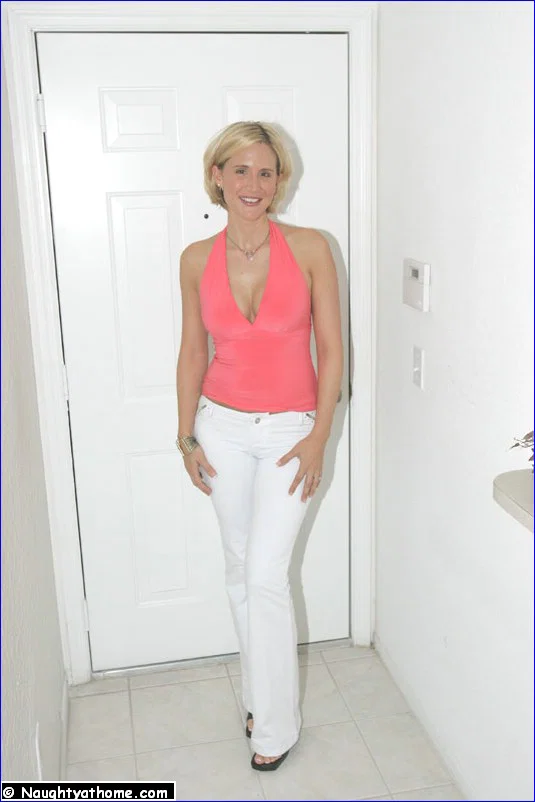 Middle-aged blonde housewife Desirae Spencer gets naked in heels on her bed  - Housewife, Mature, PAWG, Ass, MILF, High Heels, Big Tits, Fake Tits, Masturbation, Babe  - Photo 1