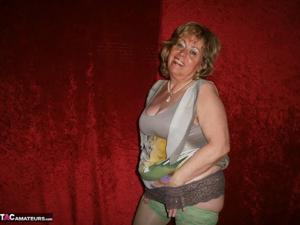 Chubby mature granny Caro in green stockings flashes lace panty cameltoe  - Granny, BBW, Amateur, Stockings, Panties, Big Tits, High Heels, Curvy, Chubby, Thick  - Photo 7