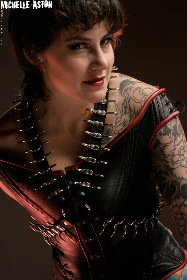 Tattooed brunette Michelle Aston shows her hairless pussy in fetish apparel  - Mature, MILF, Leather, Fetish, Boots, Tattoo, High Heels, Spreading, Pussy, Shaved  - Photo 14