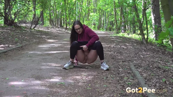Barbe pulls down black leggings to pee on a roadway through the woods  - Pissing, Public, Pussy, Glasses, Hairy, Outdoor, Close Up, Spreading, Brunette, Undressing  - Photo 3