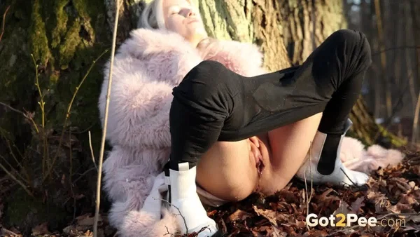 Hot blonde Vasya takes a piss in the woods against a tree in a winter coat  - Pissing, Pussy, Outdoor, Blonde, Spreading, Close Up, Shaved, Babe, Beautiful, Solo  - Photo 10