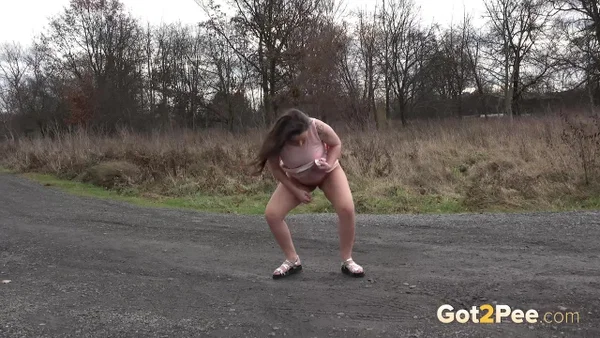 Caucasian girl Nicolette Noir takes a big piss on a dirt road in the country  - Pregnant, Pissing, Teen, Spreading, Outdoor, Czech, Non Nude, Close Up, Skirt, Tattoo  - Photo 3