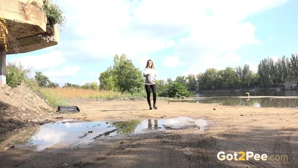 Blonde chick Barbe pulls down black leggings for a pee on a country road  - Pissing, Outdoor, Babe, Clothed, Beautiful, Ass, Undressing, PAWG, Solo  - Photo 2