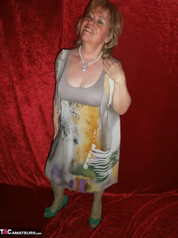 Chubby mature granny Caro in green stockings flashes lace panty cameltoe  - Granny, BBW, Amateur, Stockings, Panties, Big Tits, High Heels, Curvy, Chubby, Thick  - Photo 1