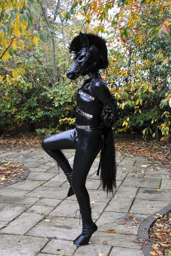 Kinky slut posing outdoors in a horse mask and a full-coverage latex outfit  - Latex, Fetish, BDSM, Bondage, Schoolgirl, Outdoor, Non Nude  - Photo 1