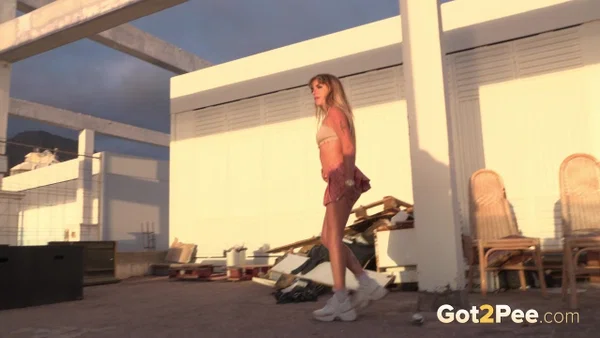 Blonde teen Melody Teen takes a piss on a concourse out of desperation  - Public, Teen, Pissing, Beautiful, Blonde, Outdoor, Skirt, Upskirt, Spreading, Ass  - Photo 4