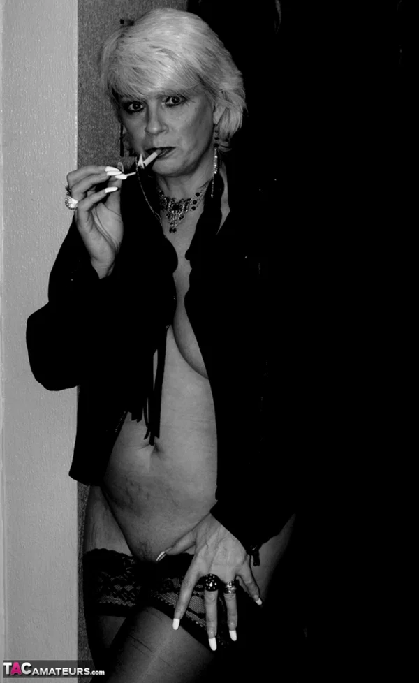 Older blonde lights a cigarette while showing her bare breasts and pussy  - Smoking, Mature, Saggy Tits, Short Hair, Amateur, Big Tits, Stockings, Hairy, Close Up, Spreading  - Photo 5