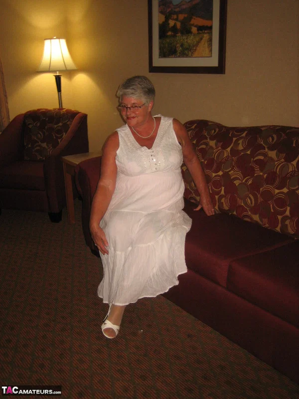 Old amateur Girdle Goddess lets her boobs loose while on a chesterfield  - Granny, BBW, Glasses, Stockings, Chubby, Amateur, Short Hair, High Heels, Curvy, Skirt  - Photo 3