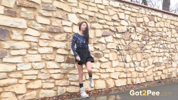 Mini Mitzi squats against a stone wall to take a badly needed piss  - Public, Petite, Outdoor, Spreading, Close Up, Pussy, Skirt, European, Czech, Non Nude  - Photo 14