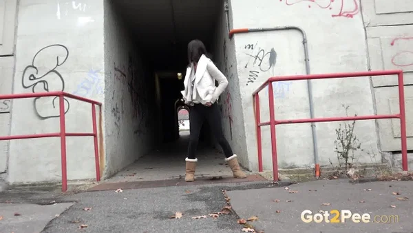 Brunette girl Eveline Neill gets caught pissing at a tunnel entrance in UGGs  - Public, Pissing, Pussy, Boots, Hairy, Spreading, Close Up, Brunette, Non Nude, Beautiful  - Photo 15