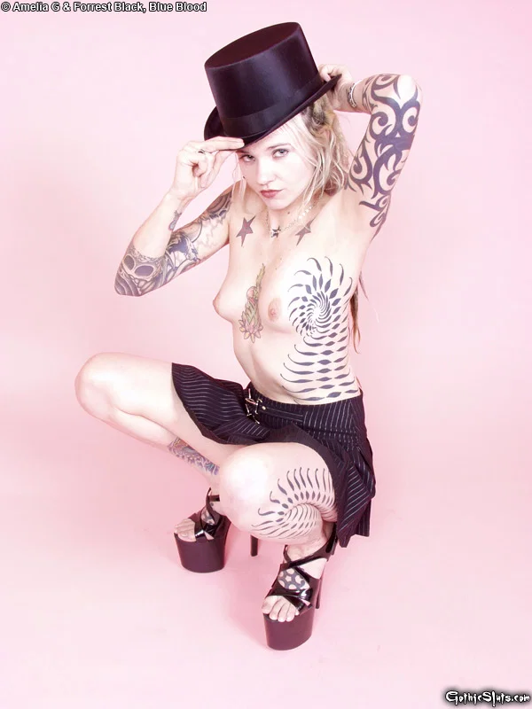 Tattooed blonde Voltaire Blue doffs a top hat while getting naked in heels  - Tattoo, Fetish, Upskirt, Skirt, High Heels, Ass, PAWG, Panties, Tiny Tits, Babe  - Photo 8